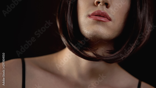 Foto Close-up of beautiful male transgender face with make-up, femininity concept