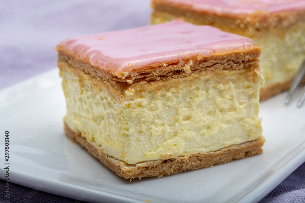Tompoes or tompouce, iconic pastry in Netherlands and Belgium made from puff dough, icing, cream Tompoes or tompouce, iconic pastry in Netherlands and Belgium made from puff dough, icing, cream