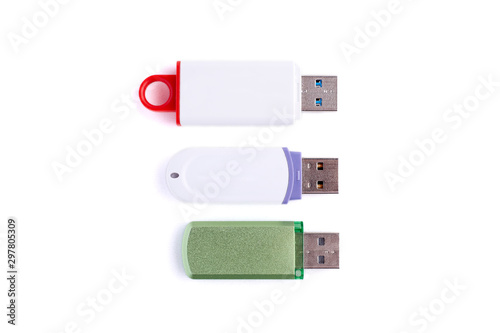 Three white USB flash drives isolated on white background.