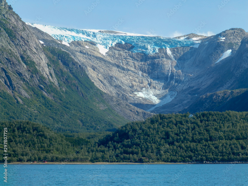 background view of glacier, beautiful mountain lake in the foreground
