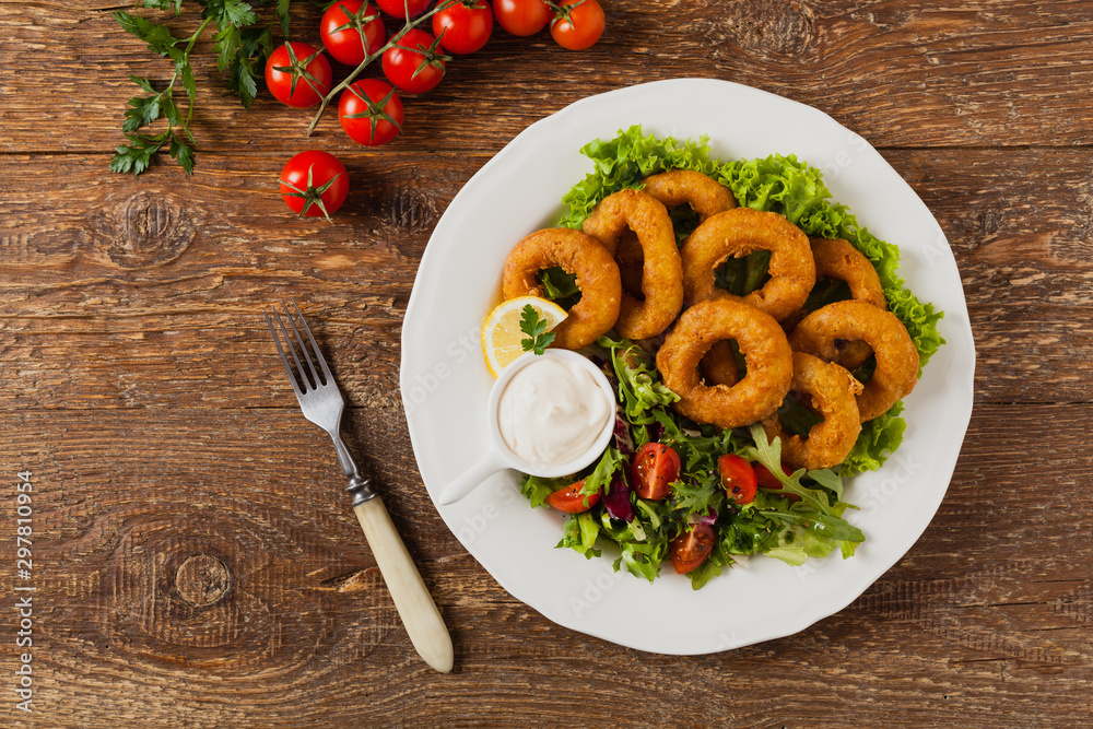 Roasted squid rings with salad. Roasted squid rings with salad.