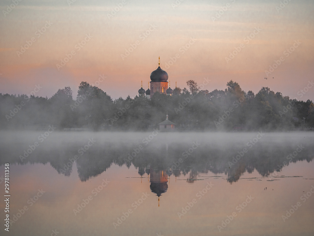 Vvedensky island monastery. Vladimir region. Misty daybreak on the lake.