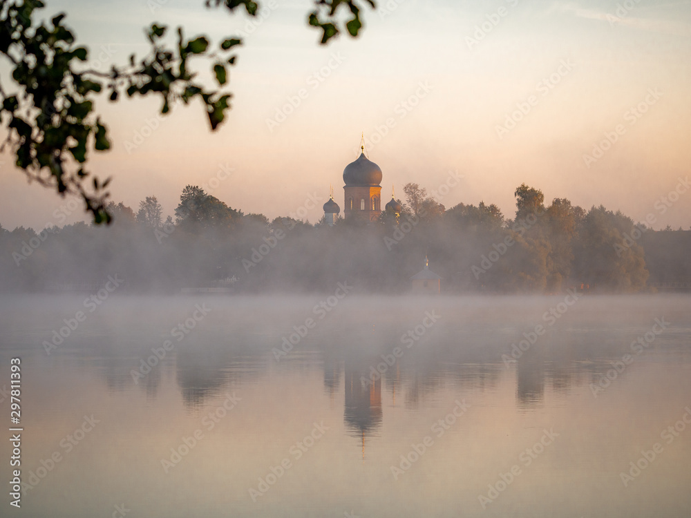 Vvedensky island monastery. Vladimir region. Misty daybreak on the lake.