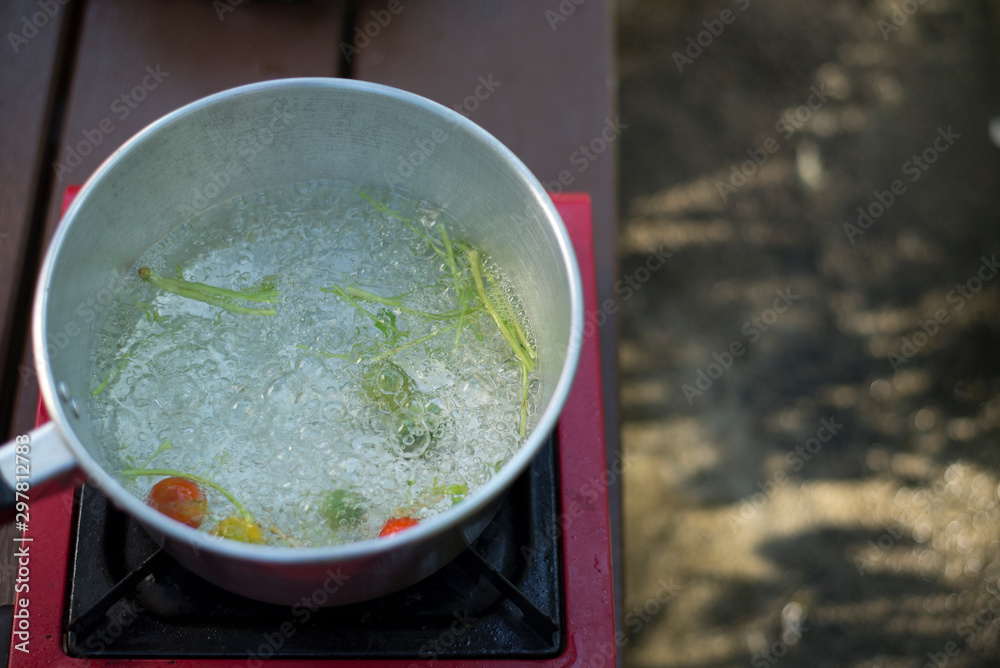Broth is hot and boiling, Camping style cooking, Copy-space Broth is hot and boiling, Camping style cooking, Copy-space