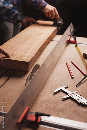 Carpentry workshop background with male hands and tools