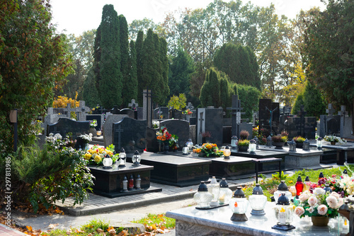 Fototapeta Graves at a Christian cemetery in autumn