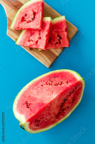 Fresh watermelon on blue background top view