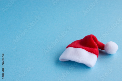  Santa hat on a blue background. Christmas and New Year holiday background. Place for text.