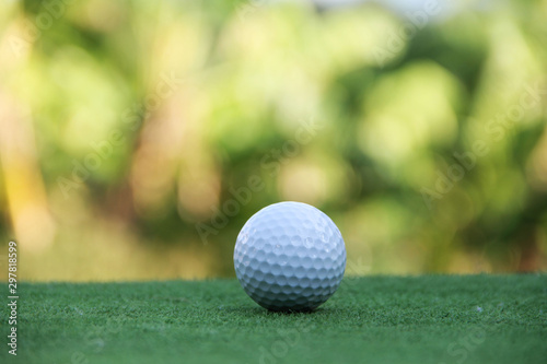 Golf ball on green grass in beautiful golf course