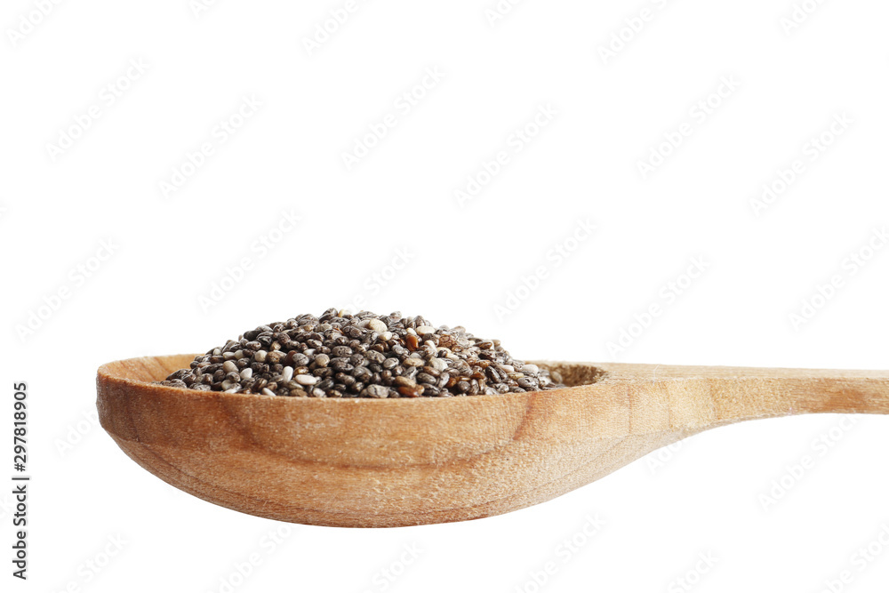 Chia in a wooden box isolated on a white background close-up. Chia in a wooden box isolated on a white background close-up.