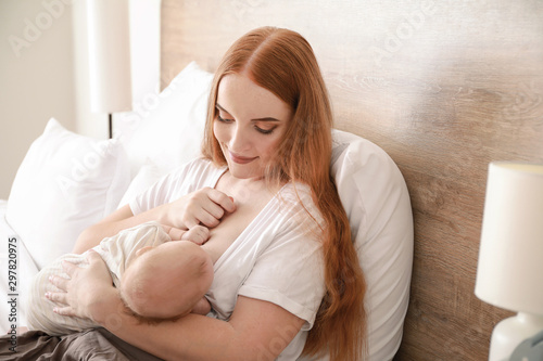 Young woman breastfeeding h...