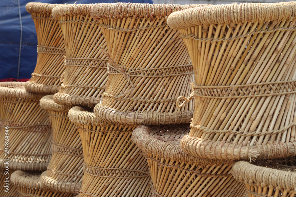 Bunch of Eco friendly Handicraft Hand-Woven Bamboo & Rope Mudda Chair for  Indoor and Outdoor Furnishings Cane Bar Stool Left View Stock Photo | Adobe  Stock