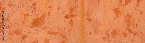 Abstract panorama image of Orange clay wall grunge texture background for interior decoration.