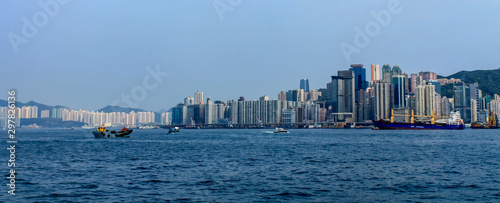 Skyline Panorama with Victoria Bay, Boats and Hongkong Island in the background. Taken from Kowloon. Hong Kong, China, Asia