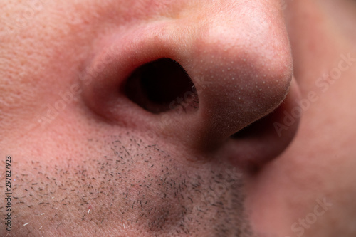 Tablou pe pânză Image of young man with nose, close up photo