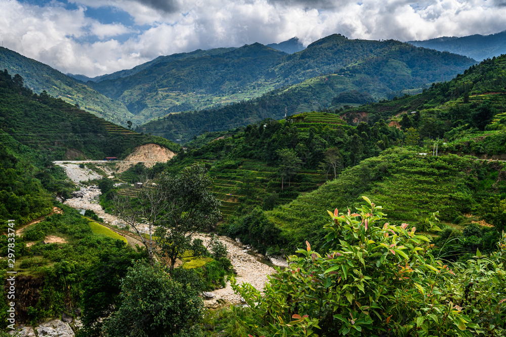Naklejka premium Mountain road in beautiful valley. Ha Giang province. Vietnam
