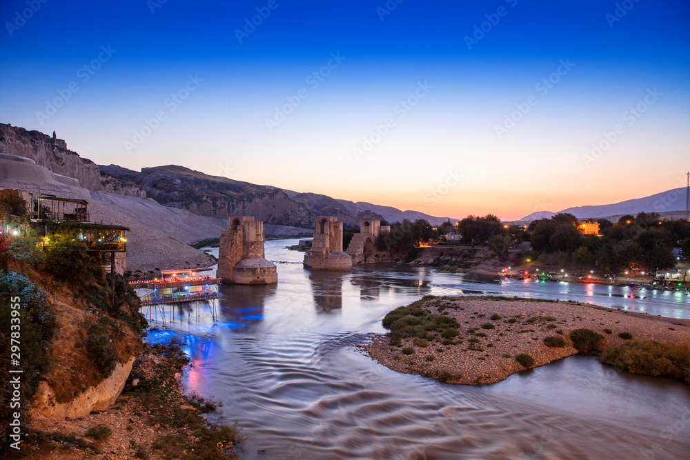 Panoramic view of the Old Tigris Bridge, Castle and minaret in the city of Hasankeyf, Turkey. Batman, Mardin Province