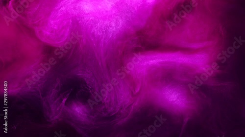 Smoke cloud motion. Phantasmic spirit. Magenta pink glitter steam flow on purple background. photo