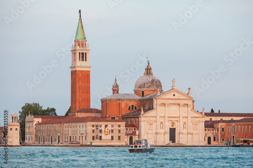 VENICE, ITALY - JUNE 15, 2016: View across the water of the Giudecca Canal to the island of San Georgio Maggiore, with its campanile and church designed by Palladio, Venice, Italy