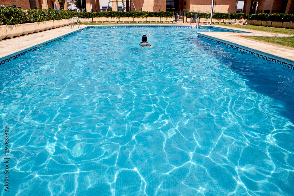 woman swimming in a pool