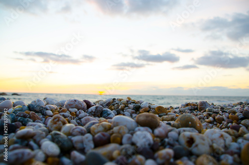 stones on beach at sunset