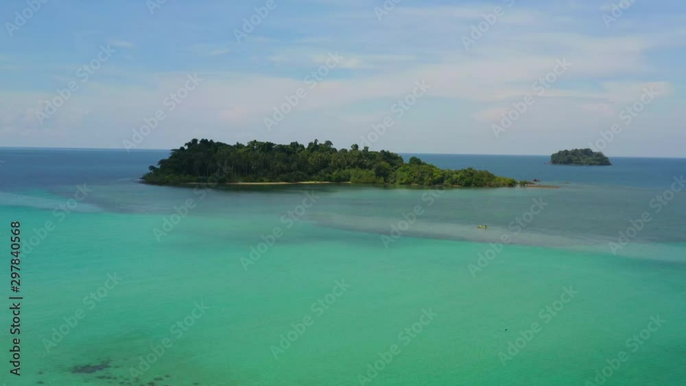Aerial view on the sea. Small tropical island with palm trees and sandy beach. Aerial view on the sea. Small tropical island with palm trees and sandy beach.
