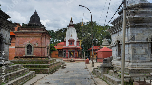 Old architecture and ancient religion buildings in the area of Pashupatinath temple in Kathmandu, Nepal photo