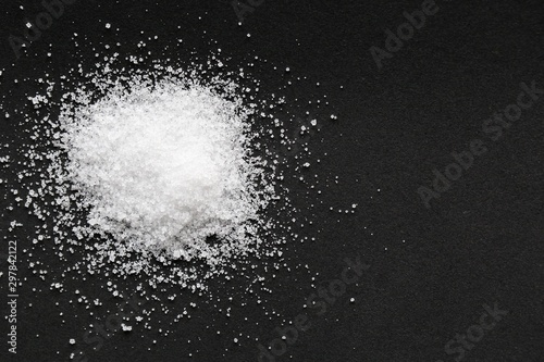 Sea salt on black background 