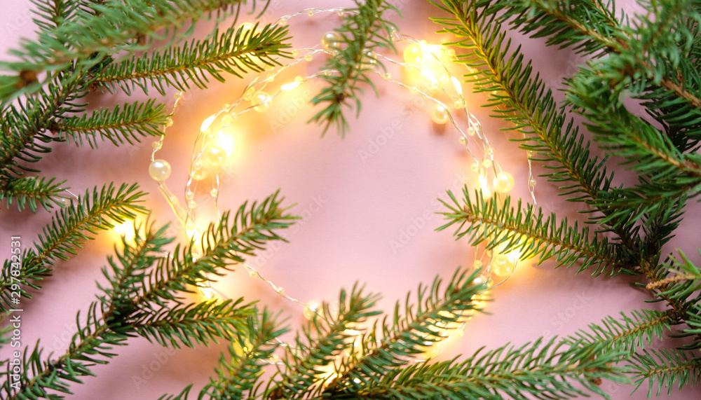 Christmas background with decorations and gift boxes on pink background