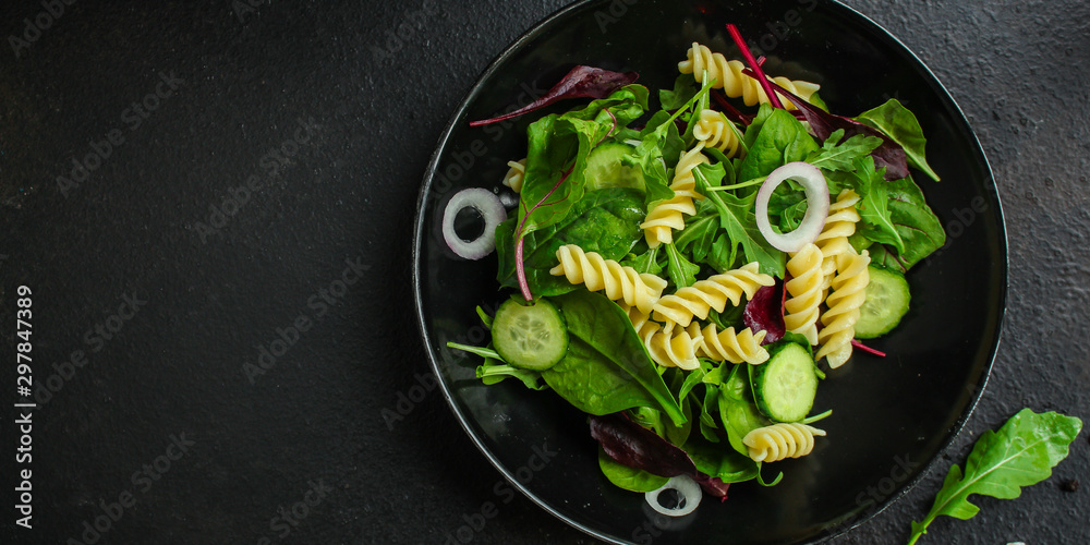 pasta salad Fusilli (leaves Lettuce, Spinach, Vegetables, Gemelli) Menu Concept. food background. copy space. Top view pasta salad Fusilli (leaves Lettuce, Spinach, Vegetables, Gemelli) Menu Concept. food background. copy space. Top view