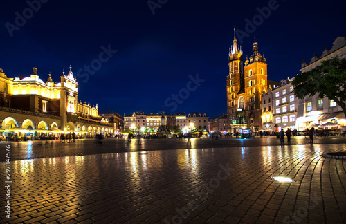 Night Krakow main square in lights. Holidays in Europe background.