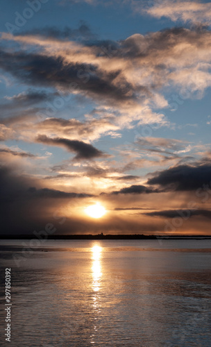 Stunningly beautiful sunrise  taken on a cloudy morning from Salthill beach near Galway  Ireland. Showing the calm water of Galway Bay and Mutton Island in the distance.