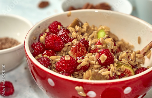 oatmeal for breakfast with raspberries, nuts and seeds
