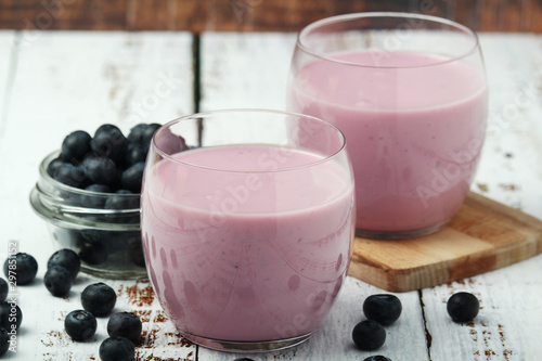 Two glasses with blueberry yogurt 