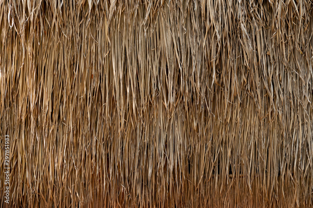 Straw that is a sheet stacked into a wall and roof for background and ...
