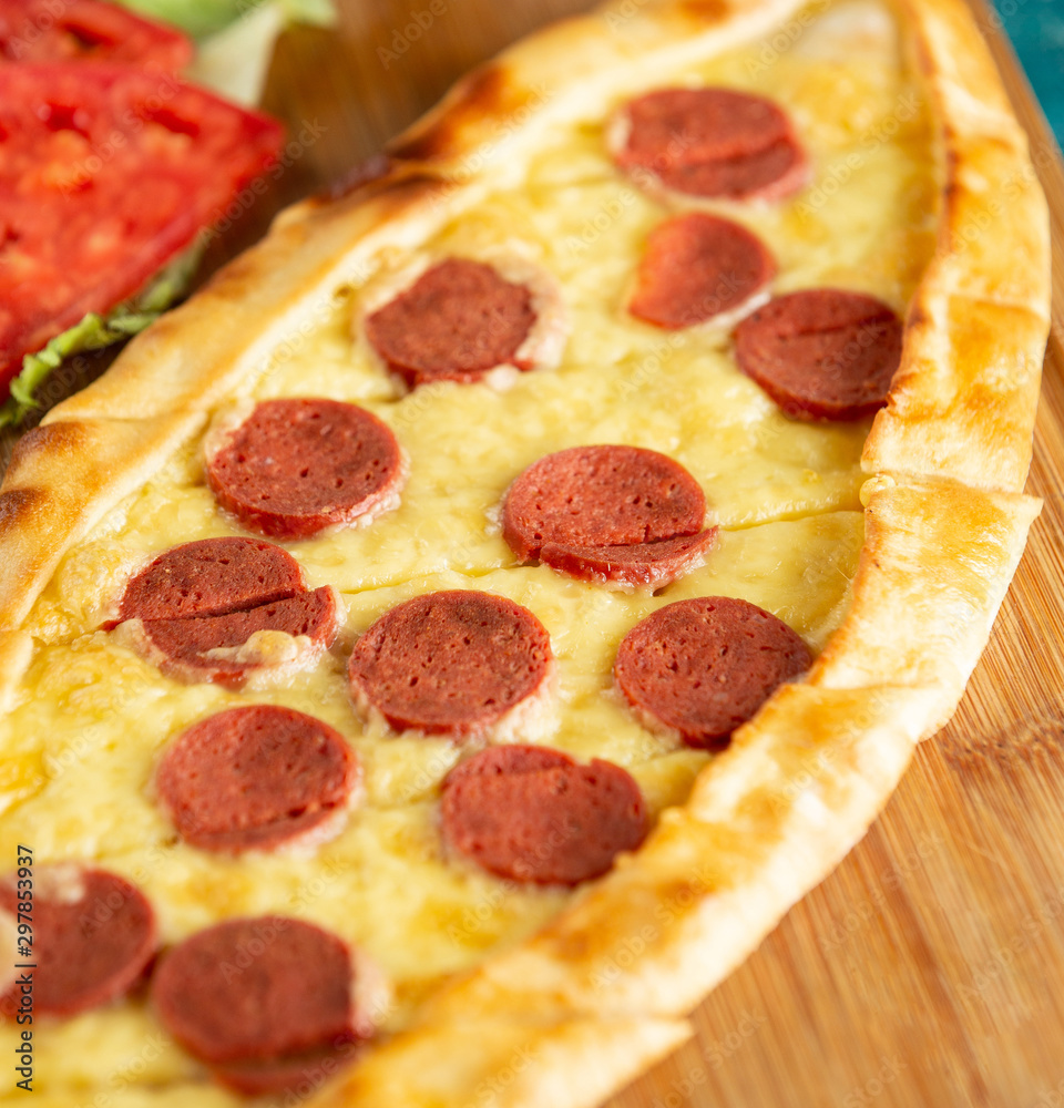 turkish pide with sausage and cheese turkish pide with sausage and cheese