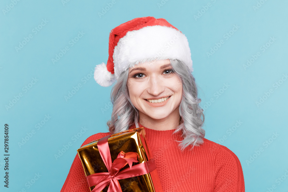 Portrait of happy santa woman hugs gift box isolated Portrait of happy santa woman hugs gift box isolated