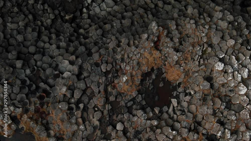 Aerial top down view of volcanic basalt formation on the sea in West Iceland Aerial top down view of volcanic basalt formation on the sea in West Iceland
