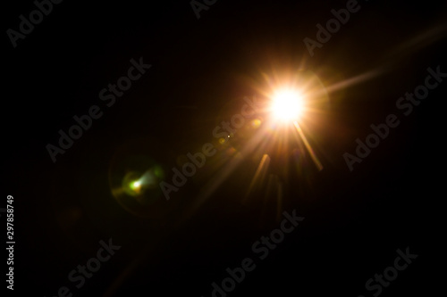 Slika na platnu abstract lens flare red light over black background