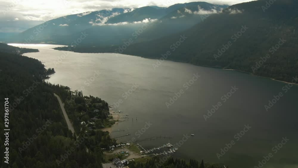 Aerial View of Kootenay River during a cloudy summer sunrise. Taken near Nelson, British Columbia, Canada. Aerial View of Kootenay River during a cloudy summer sunrise. Taken near Nelson, British Columbia, Canada.