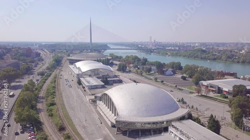 Beautiful establishing 4k aerial shot of Fair and Ada bridge in Belgrade photo