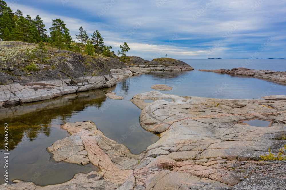 Karelia. Russia. Ladoga. The rocky coast of Ladoga. Lake in the Russian taiga. Rest at nature. Travels in Karelia. Karelia on a summer day. The nature of the Russian Federation. Tourism in Russia. Karelia. Russia. Ladoga. The rocky coast of Ladoga. Lake in the Russian taiga. Rest at nature. Travels in Karelia. Karelia on a summer day. The nature of the Russian Federation. Tourism in Russia.