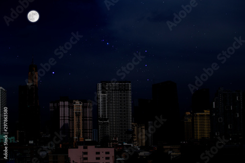 Full moon with starry over the city background. Romantic night.