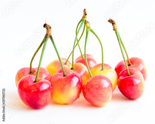 Fotografia Studio shot group of Rainier cherries with long stems isolated on white