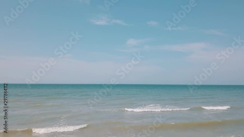 Aerial view of sand beach, waves and sea. Horizon over water