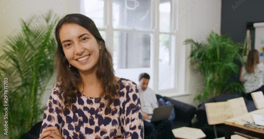 Millennial female professional working in a creative office Millennial female professional working in a creative office