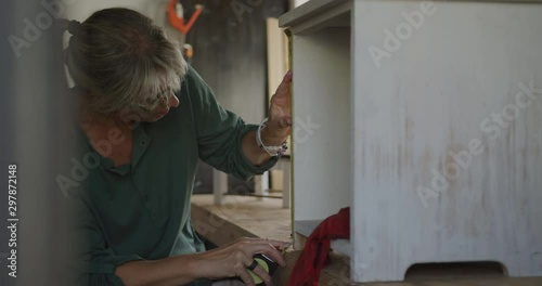 Woman doing DIY at home photo