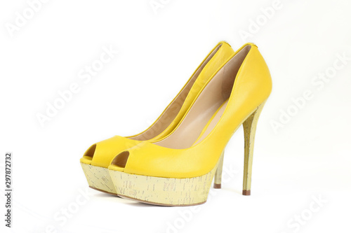 Yellow leather peet toe platform heels isolated on white background. Woman shoes with high heels.