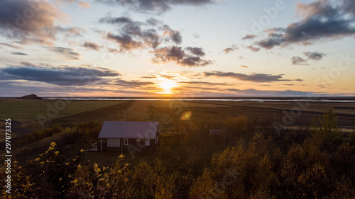sunset over cabin in iceland
