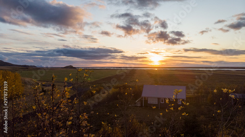 sunset over cabin in iceland